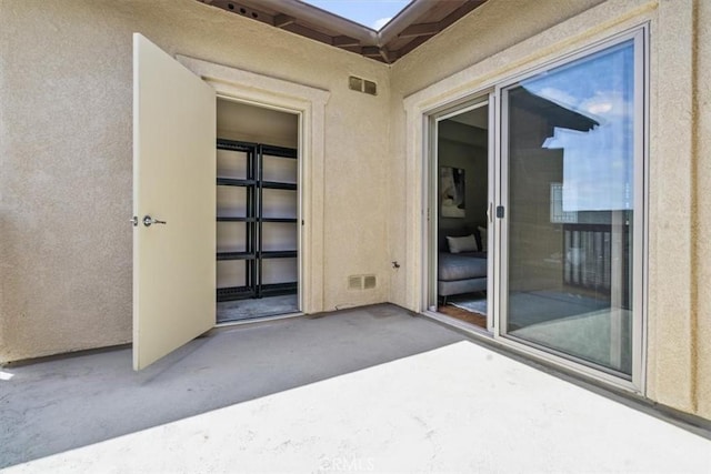 579 Camino Mercado Unit 504, Arroyo Grande, CA 93420 - doorway to property with stucco siding and a patio area