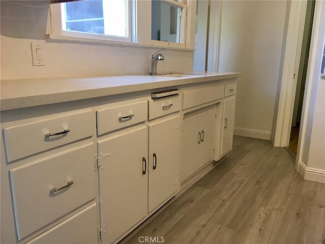 11958 Sarah St, Valley Village, CA 91607 - bathroom featuring wood finished floors, vanity, and baseboards