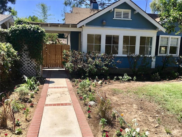 11958 Sarah St, Valley Village, CA 91607 - view of front facade featuring a chimney and roof with shingles