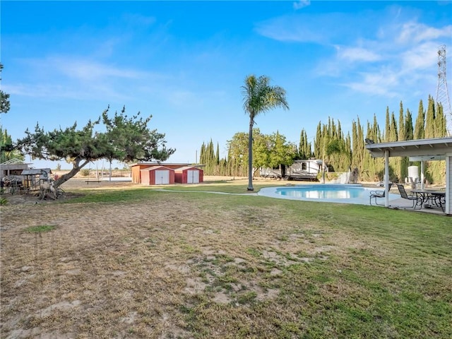 1654 W S Ave, Fresno, CA 93706 - view of grassy yard with an outdoor pool