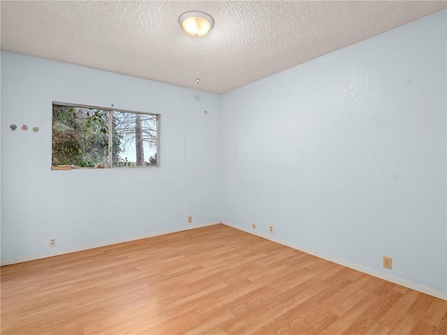 1654 W S Ave, Fresno, CA 93706 - spare room with light wood-style floors, a textured ceiling, and baseboards