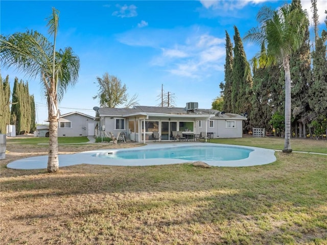 1654 W S Ave, Fresno, CA 93706 - back of house featuring an outdoor pool, a lawn, central AC, and a patio area