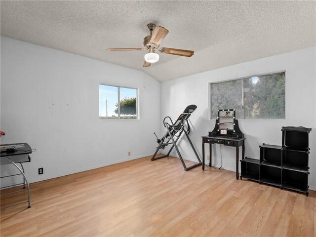 1654 W S Ave, Fresno, CA 93706 - workout area with wood finished floors, a ceiling fan, and a textured ceiling