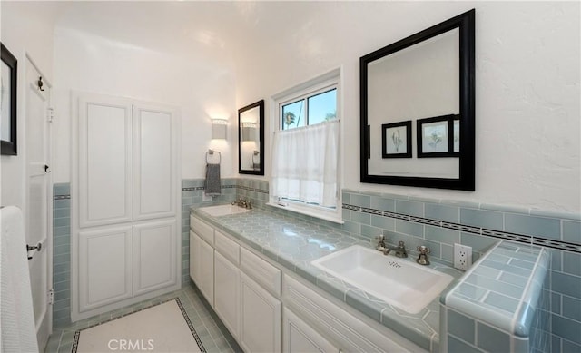 1305 E Balboa Blvd, Newport Beach, CA 92661 - bathroom featuring double vanity and tile walls