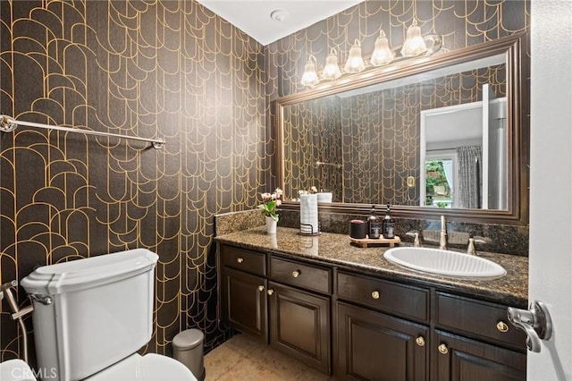 20028 Strathern St, Winnetka, CA 91306 - bathroom featuring wallpapered walls, toilet, vanity, and tile patterned flooring
