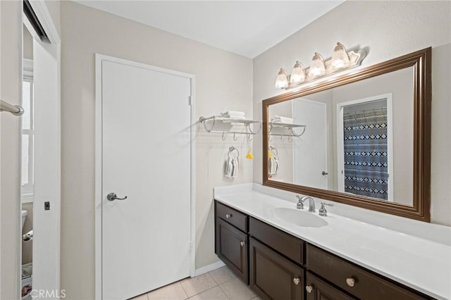20028 Strathern St, Winnetka, CA 91306 - full bath featuring vanity and tile patterned flooring
