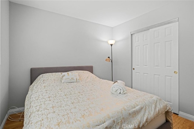 20028 Strathern St, Winnetka, CA 91306 - bedroom with a closet, baseboards, and wood finished floors