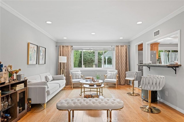 20028 Strathern St, Winnetka, CA 91306 - living area with light wood-style flooring, ornamental molding, recessed lighting, and baseboards