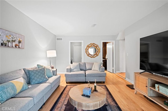 20028 Strathern St, Winnetka, CA 91306 - living room featuring wood finished floors and baseboards