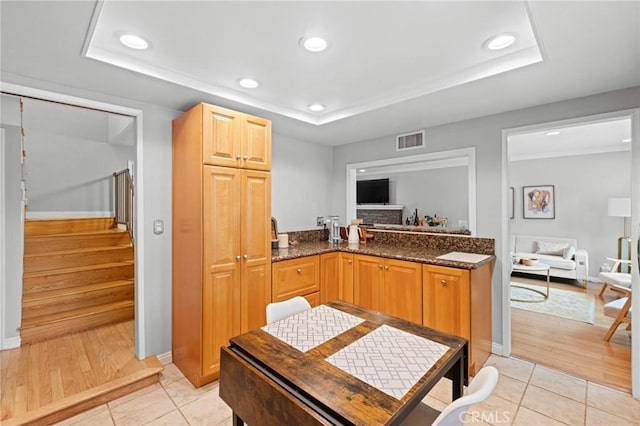 20028 Strathern St, Winnetka, CA 91306 - kitchen with a raised ceiling, light tile patterned floors, baseboards, and recessed lighting