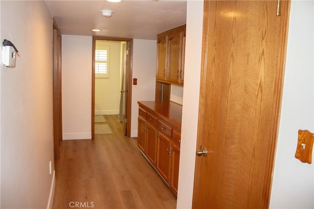 1301 Charterten Ave, Bakersfield, CA 93307 - corridor with baseboards and light wood-type flooring