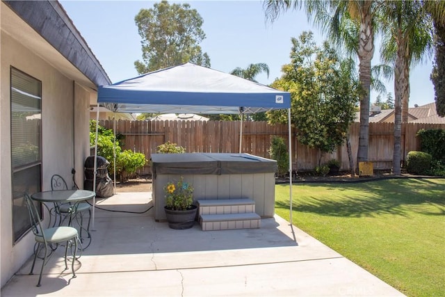 1301 Charterten Ave, Bakersfield, CA 93307 - view of patio featuring a hot tub and area for grilling