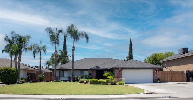 1301 Charterten Ave, Bakersfield, CA 93307 - view of front facade with an attached garage, driveway, and brick siding