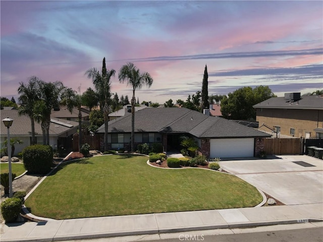 1301 Charterten Ave, Bakersfield, CA 93307 - view of front of home with a garage, driveway, a residential view, and brick siding