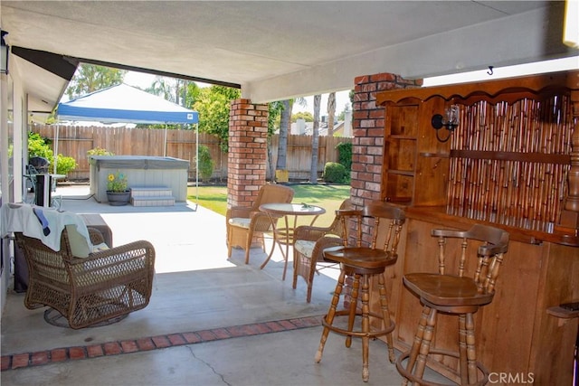 1301 Charterten Ave, Bakersfield, CA 93307 - fenced backyard featuring a hot tub and a patio area