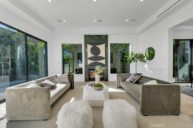 11835 Kling St, Valley Village, CA 91607 - living room featuring light wood-type flooring, a large fireplace, and recessed lighting