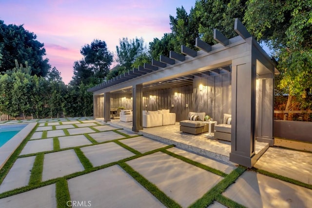 11835 Kling St, Valley Village, CA 91607 - patio terrace at dusk with an outdoor hangout area, a patio area, and a pergola