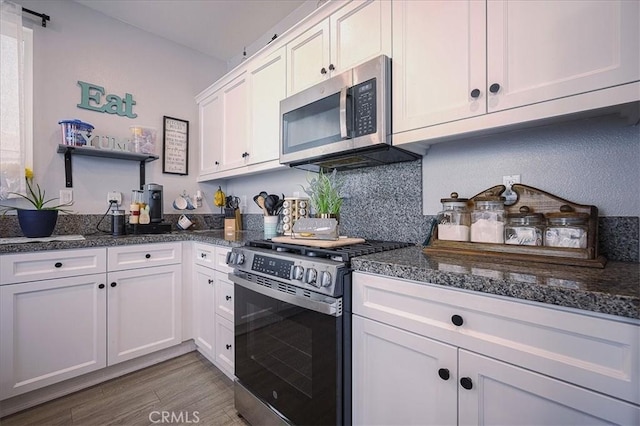 5240 Wintercress Ave, Fontana, CA 92336 - kitchen with appliances with stainless steel finishes, white cabinets, wood finished floors, and open shelves