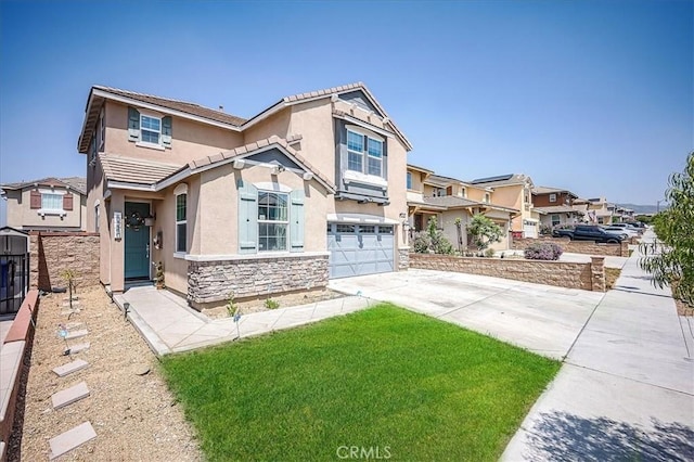 5240 Wintercress Ave, Fontana, CA 92336 - view of front facade featuring stucco siding, concrete driveway, stone siding, a garage, and a tiled roof