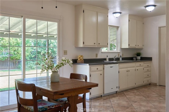 512 Maple St, Willows, CA 95988 - kitchen featuring dishwasher, dark countertops, a sink, and white cabinets