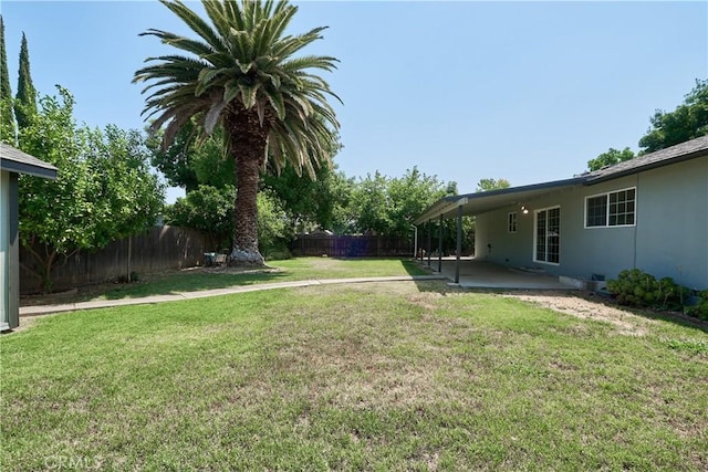 512 Maple St, Willows, CA 95988 - view of yard featuring a patio area and a carport