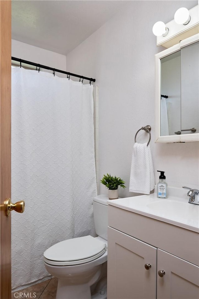 512 Maple St, Willows, CA 95988 - full bath with vanity, toilet, tile patterned flooring, and a shower with curtain