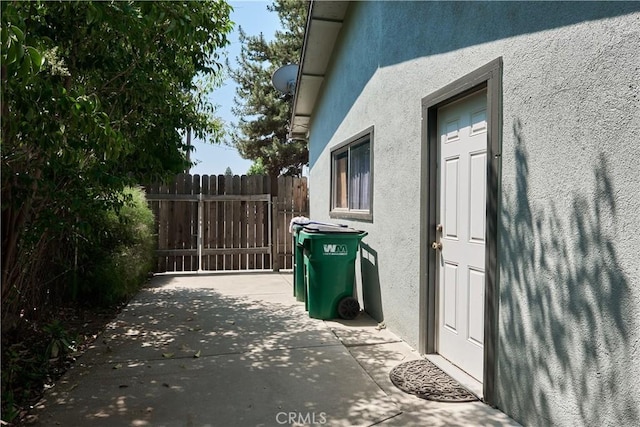 512 Maple St, Willows, CA 95988 - view of side of property featuring stucco siding and a patio area
