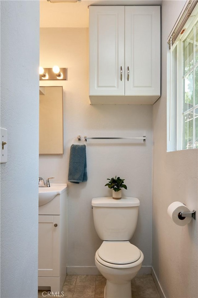 512 Maple St, Willows, CA 95988 - bathroom featuring baseboards, vanity, toilet, and tile patterned floors