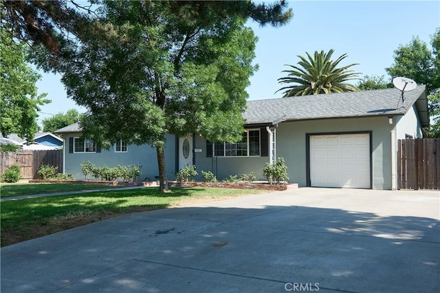 512 Maple St, Willows, CA 95988 - ranch-style house featuring stucco siding, driveway, and a garage