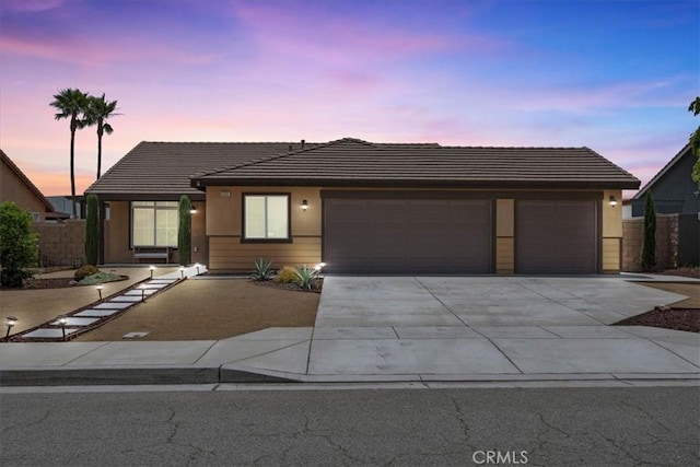 1331 Nicholas Ct, Rialto, CA 92377 - ranch-style house featuring a garage, a tiled roof, concrete driveway, and stucco siding