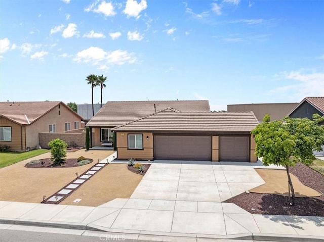 1331 Nicholas Ct, Rialto, CA 92377 - view of front facade with an attached garage, driveway, a tile roof, and stucco siding