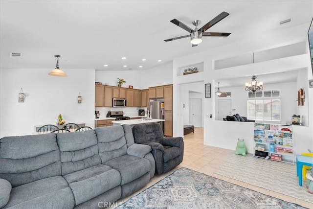 1331 Nicholas Ct, Rialto, CA 92377 - living room featuring a ceiling fan, a chandelier, light tile patterned flooring, recessed lighting, and a towering ceiling