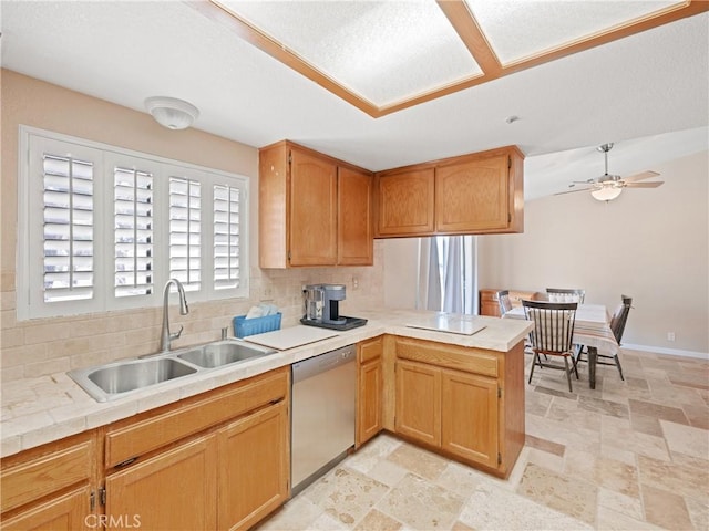 13044 Smith Rd, Phelan, CA 92371 - kitchen with dishwasher, a sink, decorative backsplash, a peninsula, and light countertops