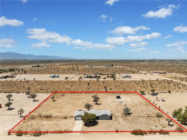 13044 Smith Rd, Phelan, CA 92371 - aerial view of sparsely populated area featuring a desert landscape, property boundaries highlighted, and a mountain backdrop