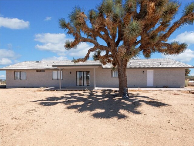 13044 Smith Rd, Phelan, CA 92371 - rear view of house with a tile roof and stucco siding