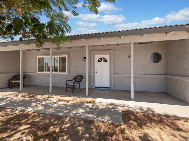 13044 Smith Rd, Phelan, CA 92371 - entrance to property with covered porch and stucco siding