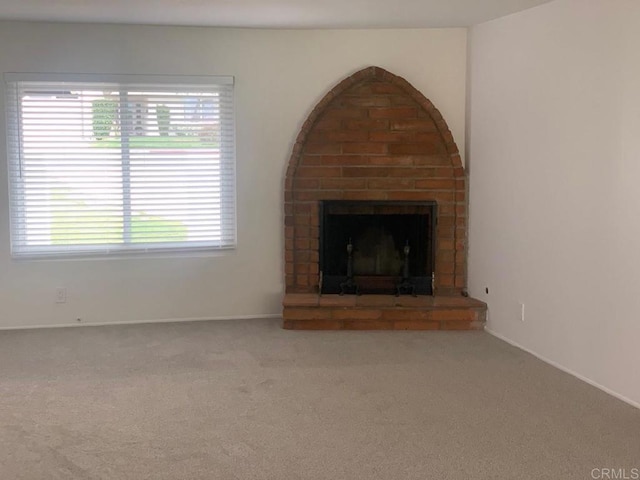 3465 Spanish Way, Carlsbad, CA 92008 - unfurnished living room featuring a brick fireplace, carpet floors, and baseboards
