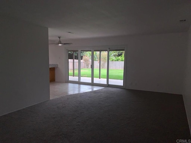 3465 Spanish Way, Carlsbad, CA 92008 - unfurnished room with light carpet, a ceiling fan, and light tile patterned floors