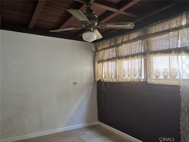 919 Dexter St, Los Angeles, CA 90042 - empty room with wood finished floors, ceiling fan, and wooden ceiling with exposed beams