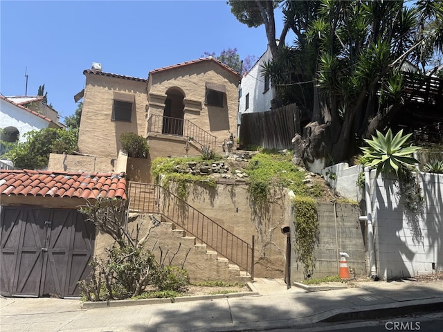 919 Dexter St, Los Angeles, CA 90042 - mediterranean / spanish-style house featuring a tile roof and stucco siding