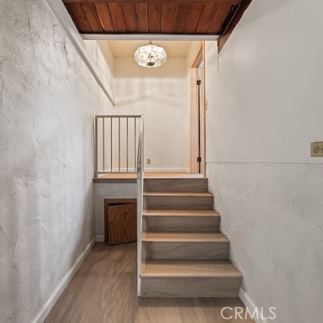 919 Dexter St, Los Angeles, CA 90042 - stairs with wood finished floors and a chandelier