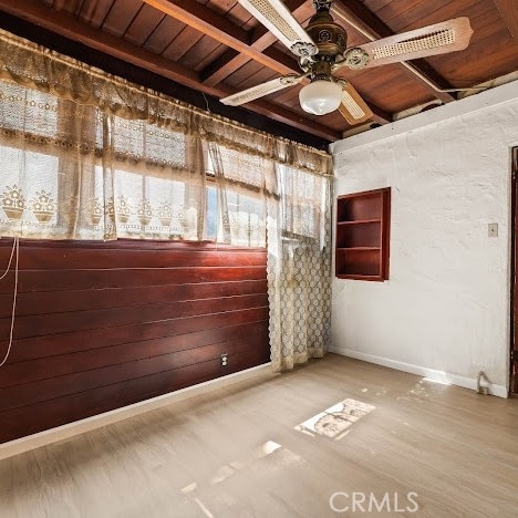 919 Dexter St, Los Angeles, CA 90042 - spare room with a wooden ceiling with exposed beams, ceiling fan, and wood finished floors