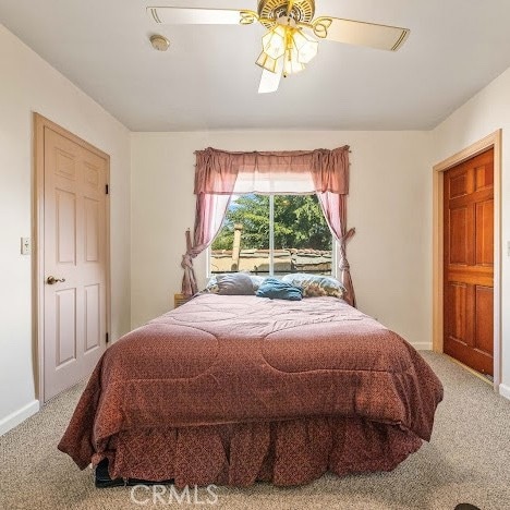919 Dexter St, Los Angeles, CA 90042 - carpeted bedroom featuring baseboards and ceiling fan
