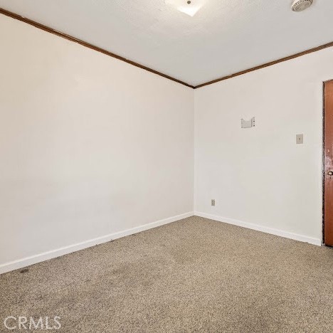 919 Dexter St, Los Angeles, CA 90042 - unfurnished room with carpet floors and crown molding