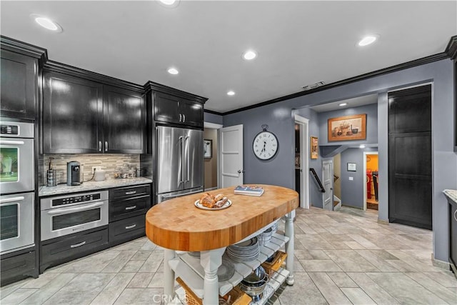 536 W Palm Dr, Arcadia, CA 91007 - kitchen featuring stainless steel appliances, dark cabinetry, ornamental molding, backsplash, and recessed lighting