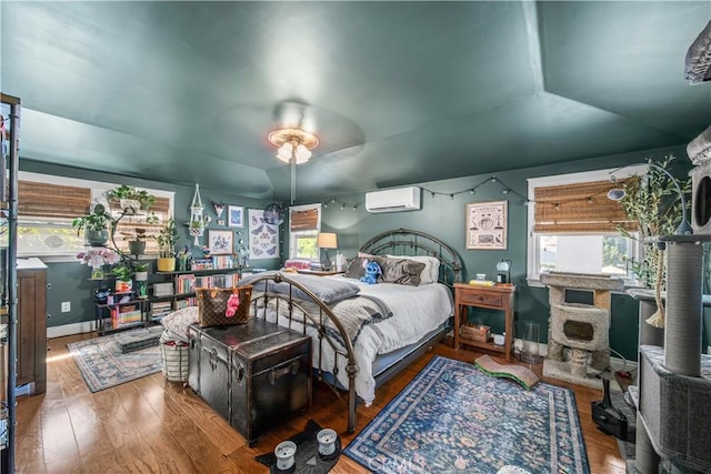536 W Palm Dr, Arcadia, CA 91007 - bedroom with wood finished floors, baseboards, and a wall mounted air conditioner