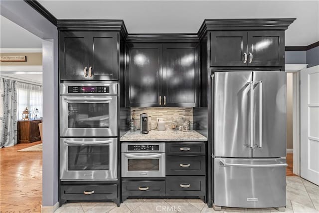 536 W Palm Dr, Arcadia, CA 91007 - kitchen featuring stainless steel appliances, ornamental molding, dark cabinetry, and decorative backsplash
