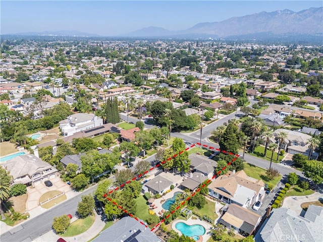 536 W Palm Dr, Arcadia, CA 91007 - aerial perspective of suburban area featuring a mountain backdrop, property boundaries highlighted, and a pool area