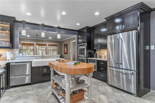 536 W Palm Dr, Arcadia, CA 91007 - kitchen featuring stainless steel appliances, a sink, ornamental molding, open shelves, and butcher block countertops
