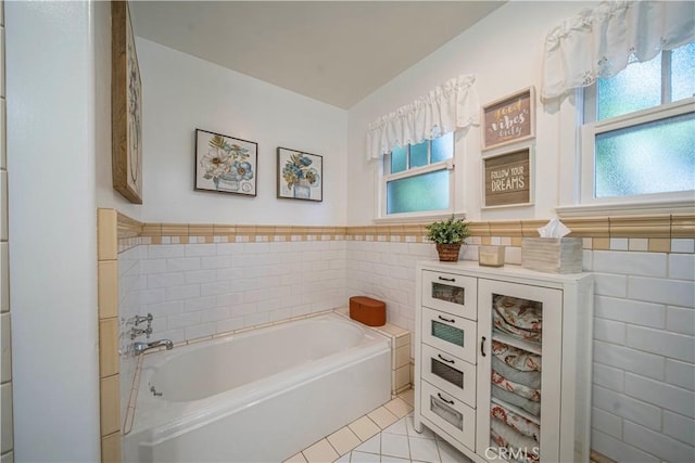536 W Palm Dr, Arcadia, CA 91007 - bathroom with tile walls, a bath, a wainscoted wall, and tile patterned flooring